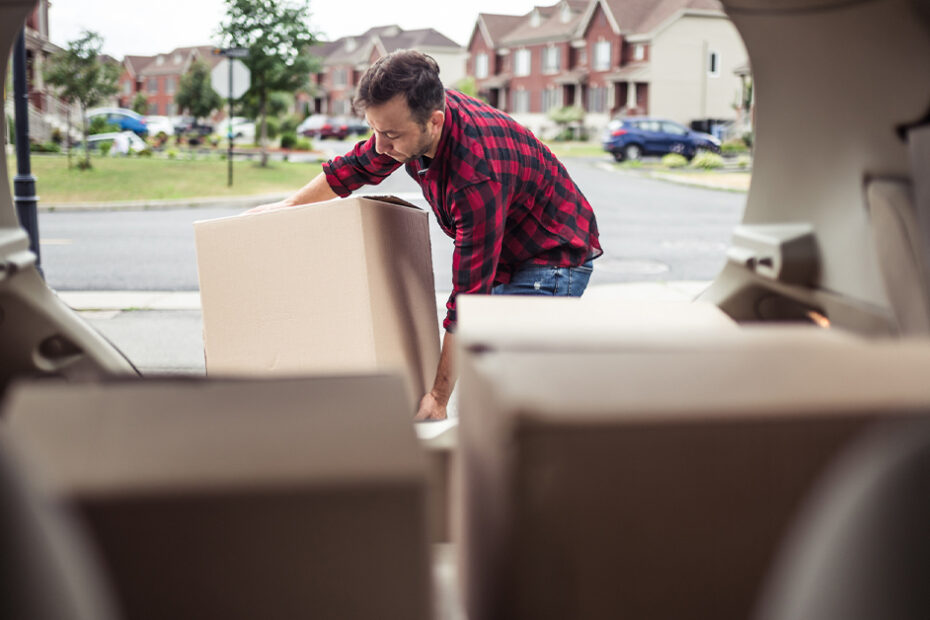 a person moving to a new state packing car