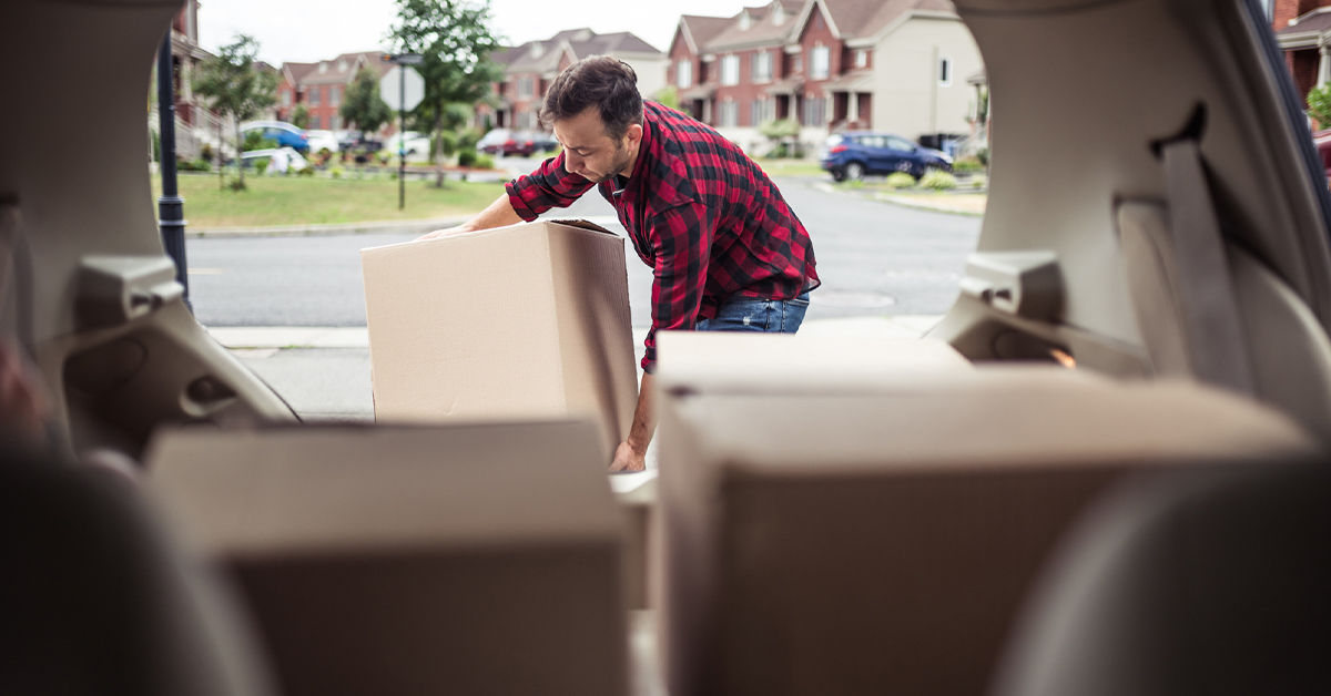 a person moving to a new state packing car