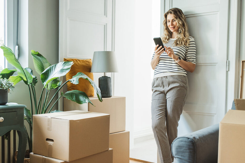 person taking break from moving to review their auto insurance