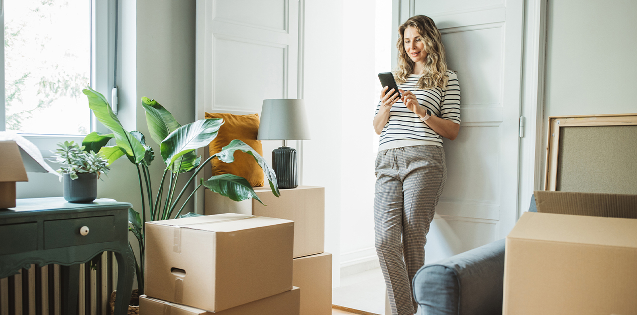 person taking break from moving to review their auto insurance