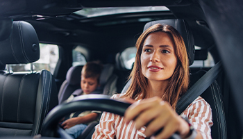 mother driving child before morning auto commute
