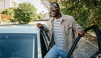 person getting into car