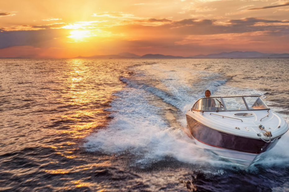 boat owner on the water at sunset