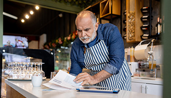 cafe owner checking declaration page