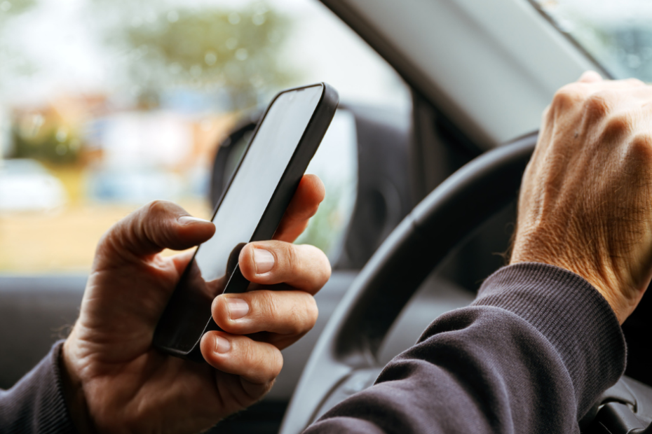 person texting and driving