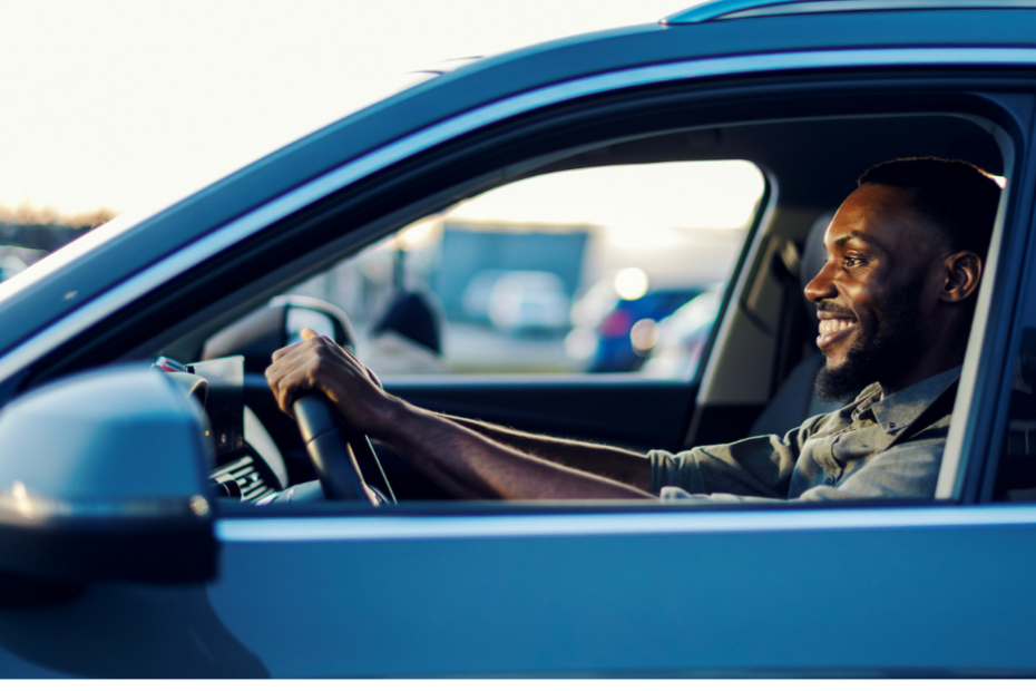 happy person driving in their car