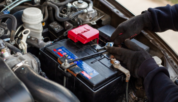 car battery being worked on in a car