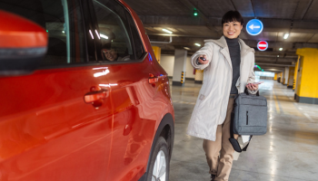 person unlocking rental car