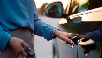 a person opening rental car door
