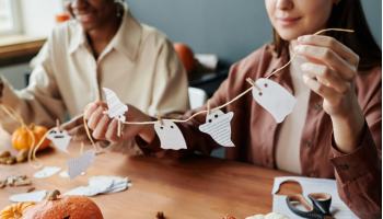 people making halloween decorations out of paper at home